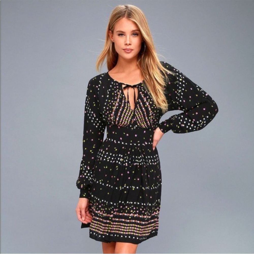 Free people long sleeve mini dress with open back.